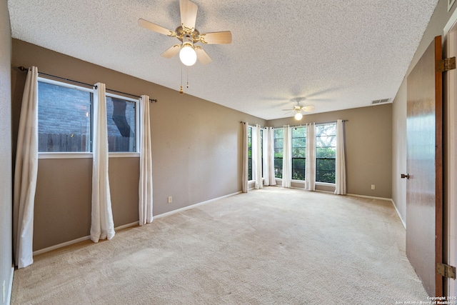 2822 Low Oak, San Antonio, TX 78232 - carpeted empty room featuring a textured ceiling, a ceiling fan, and baseboards