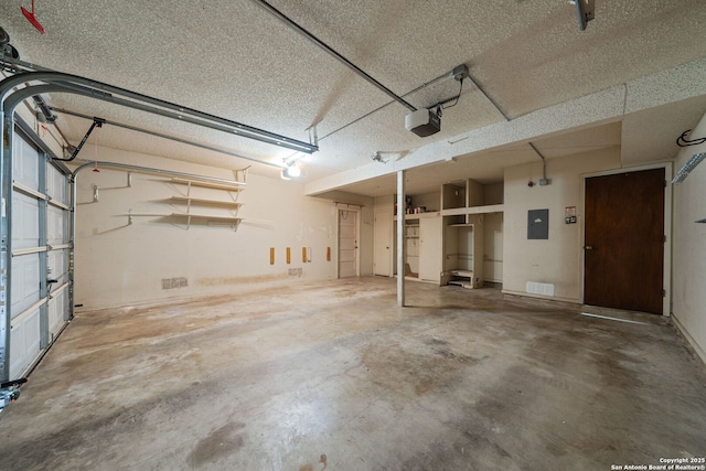 2822 Low Oak, San Antonio, TX 78232 - garage featuring a garage door opener and electric panel