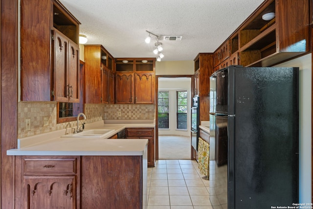 2822 Low Oak, San Antonio, TX 78232 - kitchen featuring black appliances, open shelves, a sink, light tile patterned floors, and light countertops