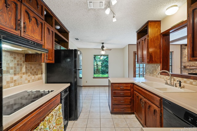 2822 Low Oak, San Antonio, TX 78232 - kitchen with black appliances, a sink, open shelves, light countertops, and a textured ceiling