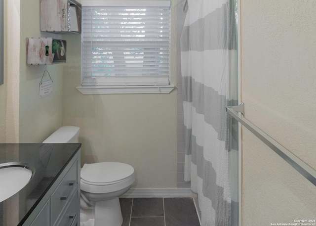 522 Rector, San Antonio, TX 78216 - full bathroom featuring vanity, tile patterned flooring, toilet, and a shower with curtain