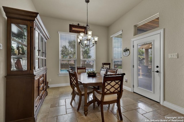 108 Westfield Ln, Vernia, TX 78121 - dining room featuring stone tile flooring, baseboards, and a chandelier