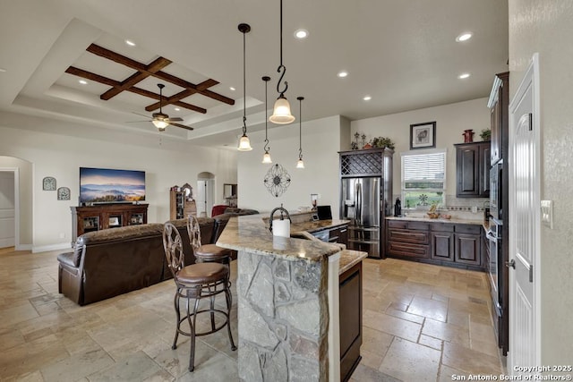 108 Westfield Ln, Vernia, TX 78121 - kitchen featuring arched walkways, stone tile flooring, appliances with stainless steel finishes, ceiling fan, and recessed lighting