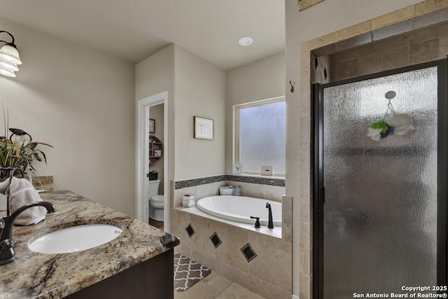 108 Westfield Ln, Vernia, TX 78121 - bathroom with toilet, a bath, a shower stall, double vanity, and tile patterned flooring