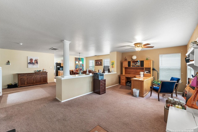 6743 Spearwood, Live Oak, TX 78233 - living room featuring decorative columns, healthy amount of natural light, light carpet, a ceiling fan, and a textured ceiling