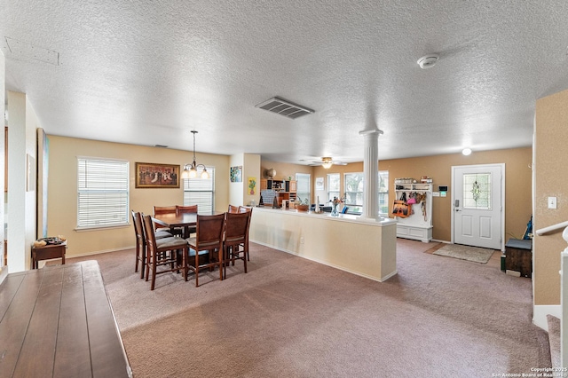 6743 Spearwood, Live Oak, TX 78233 - carpeted dining space with ceiling fan, a textured ceiling, ornate columns, and baseboards