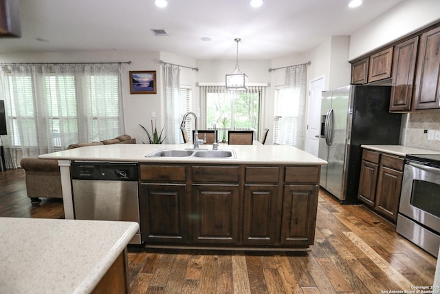 7239 Summer Way, San Antonio, TX 78240 - kitchen featuring a sink, stainless steel appliances, recessed lighting, light countertops, and dark brown cabinets