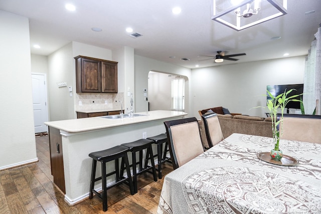 7239 Summer Way, San Antonio, TX 78240 - dining room featuring arched walkways, dark wood-style flooring, a ceiling fan, recessed lighting, and baseboards