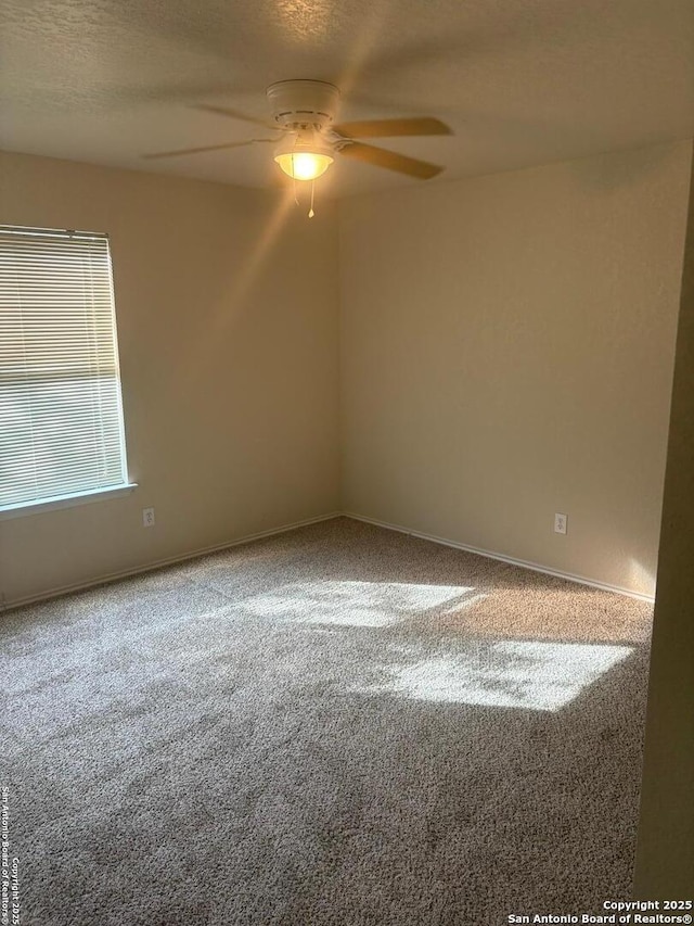 1230 Range Fld, San Antonio, TX 78245 - carpeted empty room with a ceiling fan, baseboards, and a textured ceiling