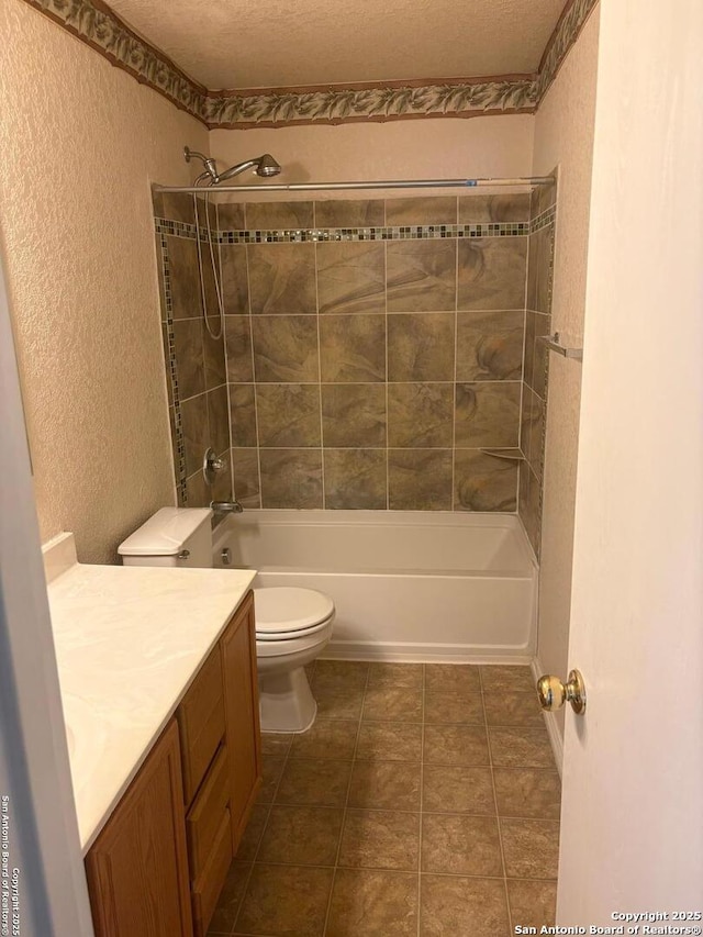 1230 Range Fld, San Antonio, TX 78245 - bathroom with a textured wall, vanity, toilet, and tub / shower combination