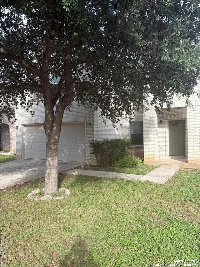 1230 Range Fld, San Antonio, TX 78245 - obstructed view of property with brick siding, driveway, a garage, and a front lawn