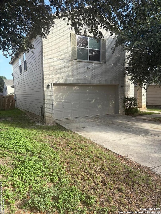 1230 Range Fld, San Antonio, TX 78245 - view of front of house with brick siding, an attached garage, and concrete driveway