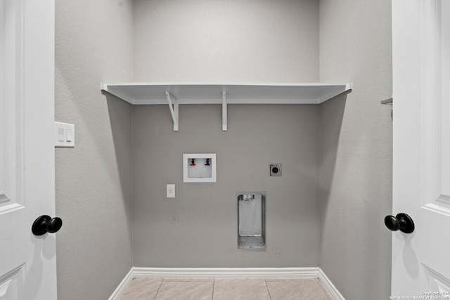 546 Indian Scout, Spring Branch, TX 78070 - laundry room with hookup for a washing machine, electric dryer hookup, baseboards, and tile patterned flooring