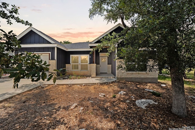 546 Indian Scout, Spring Branch, TX 78070 - view of front facade featuring a garage and board and batten siding