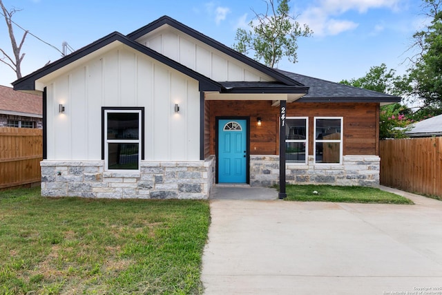 241 Hawthorne, San Antonio, TX 78214 - view of front of home with stone siding, board and batten siding, and a shingled roof