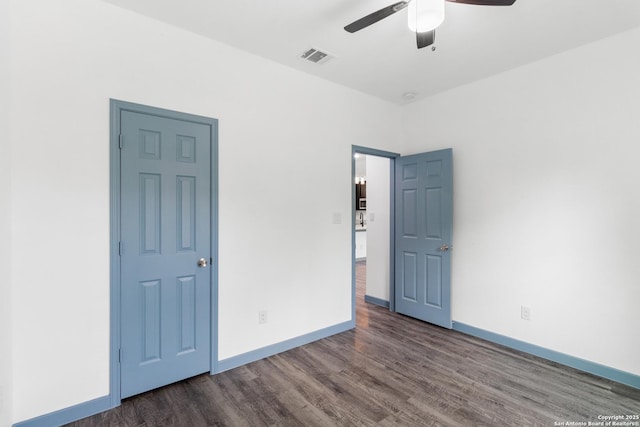 241 Hawthorne, San Antonio, TX 78214 - unfurnished bedroom featuring wood finished floors, baseboards, and ceiling fan