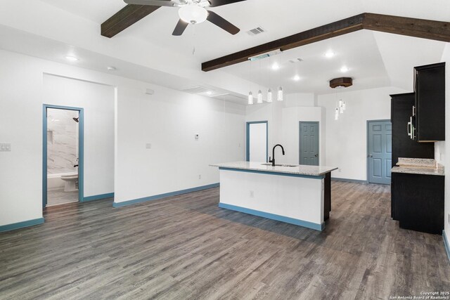 241 Hawthorne, San Antonio, TX 78214 - kitchen with a sink, beam ceiling, ceiling fan, an island with sink, and wood finished floors