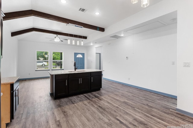 241 Hawthorne, San Antonio, TX 78214 - kitchen featuring a sink, open floor plan, wood finished floors, beam ceiling, and a ceiling fan