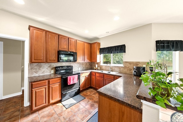 3353 Joshs Way, Marion, TX 78124 - kitchen with black appliances, a sink, brown cabinetry, decorative backsplash, and recessed lighting
