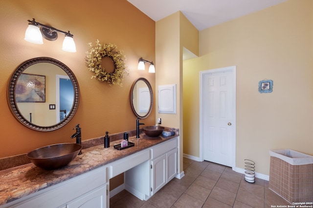 5626 Timber Strm, San Antonio, TX 78250 - bathroom with double vanity, tile patterned flooring, and baseboards