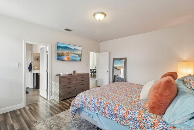 5903 Carriage Cpe, San Antonio, TX 78261 - bedroom with dark wood-style floors and baseboards