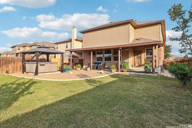 5903 Carriage Cpe, San Antonio, TX 78261 - back of house featuring a hot tub, a patio area, and a gazebo