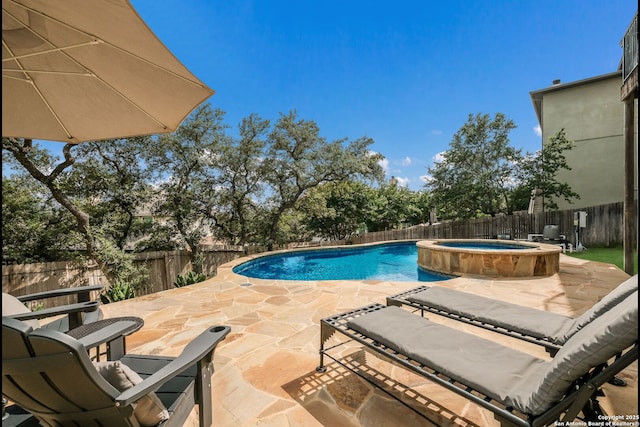 23414 Seven Winds, San Antonio, TX 78258 - view of swimming pool featuring a patio area, a fenced backyard, and a pool with connected hot tub