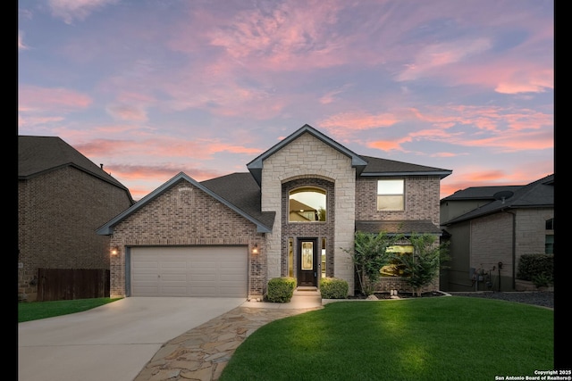 23414 Seven Winds, San Antonio, TX 78258 - french provincial home featuring brick siding, concrete driveway, an attached garage, and roof with shingles