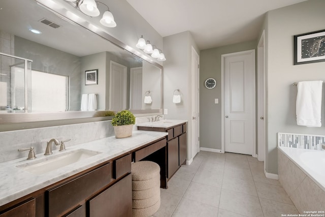 23414 Seven Winds, San Antonio, TX 78258 - full bathroom featuring tile patterned floors, double vanity, a garden tub, and a shower stall