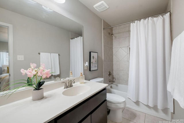 23414 Seven Winds, San Antonio, TX 78258 - bathroom with toilet, vanity, tile patterned floors, and shower / bath combo