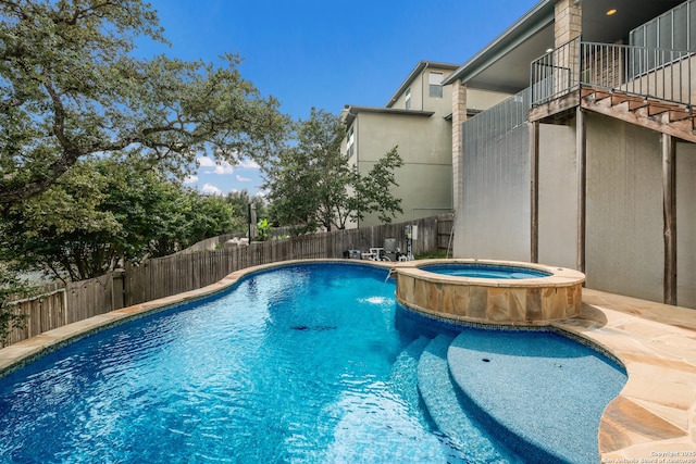 23414 Seven Winds, San Antonio, TX 78258 - view of swimming pool featuring a fenced backyard and a pool with connected hot tub
