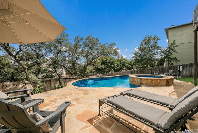 23414 Seven Winds, San Antonio, TX 78258 - view of swimming pool featuring a patio, a fenced backyard, and a pool with connected hot tub