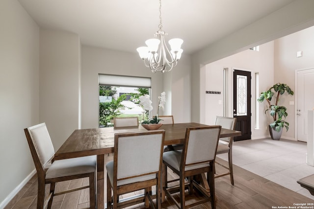 23414 Seven Winds, San Antonio, TX 78258 - dining room featuring a chandelier and baseboards