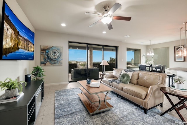23414 Seven Winds, San Antonio, TX 78258 - living room with light tile patterned floors, a ceiling fan, a chandelier, recessed lighting, and baseboards