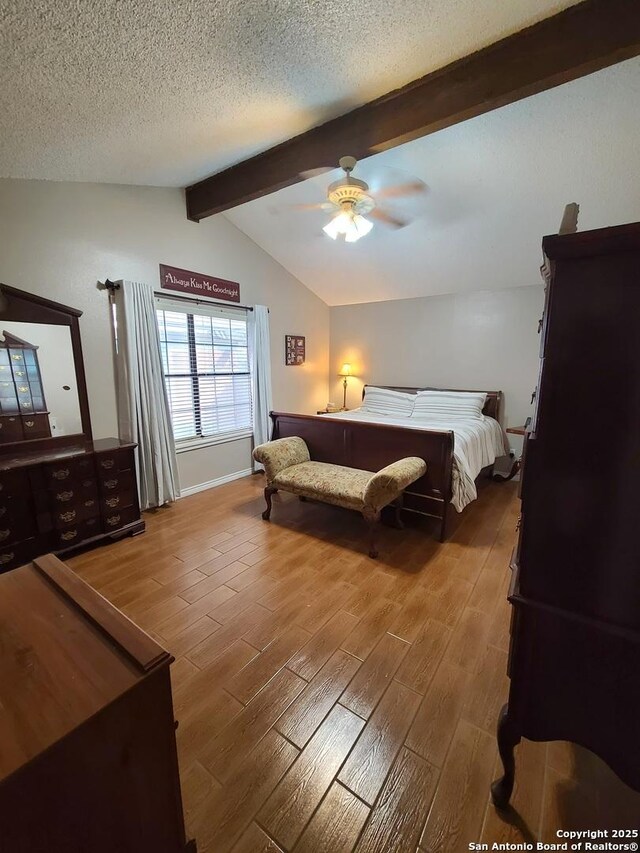 117 Larkspur, Uvalde, TX 78801 - bedroom featuring wood finished floors, a textured ceiling, and a ceiling fan