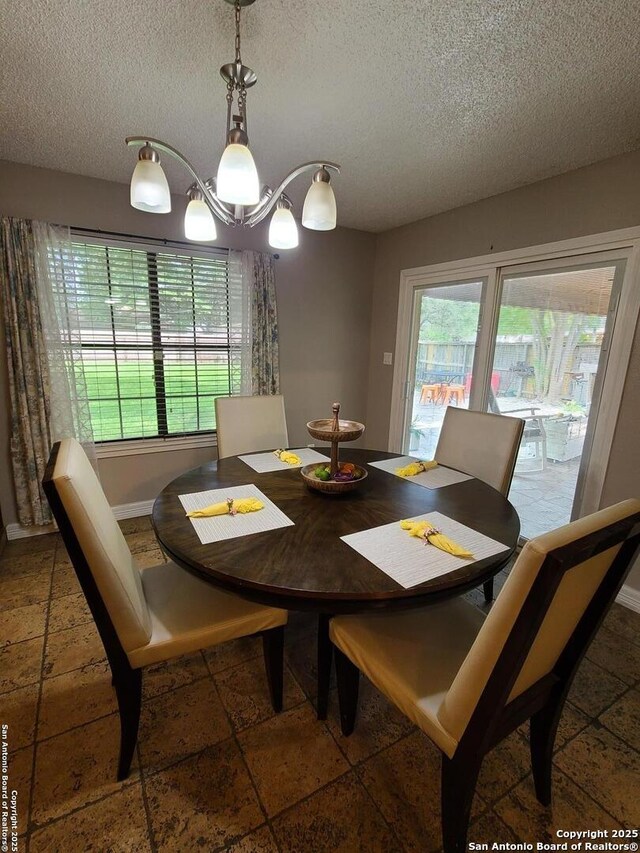 117 Larkspur, Uvalde, TX 78801 - dining room with a textured ceiling and baseboards