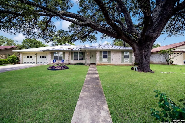 713 Fawndale, Windcrest, TX 78239 - ranch-style house featuring a standing seam roof, an attached garage, a front lawn, and brick siding