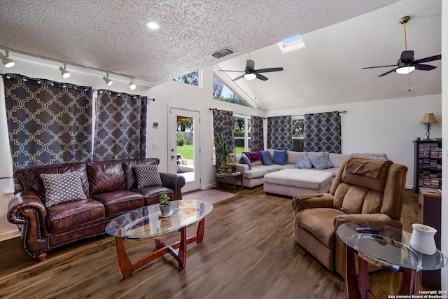 713 Fawndale, Windcrest, TX 78239 - living room featuring ceiling fan, wood finished floors, a textured ceiling, lofted ceiling, and rail lighting