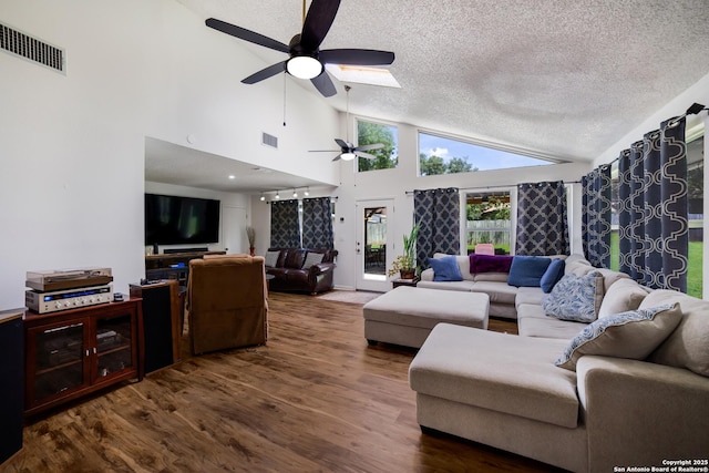 713 Fawndale, Windcrest, TX 78239 - living area featuring a ceiling fan, lofted ceiling, a textured ceiling, and wood finished floors