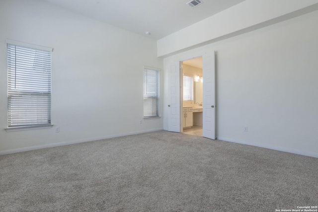 8639 Hedford, San Antonio, TX 78254 - unfurnished bedroom featuring light colored carpet, baseboards, and ensuite bathroom