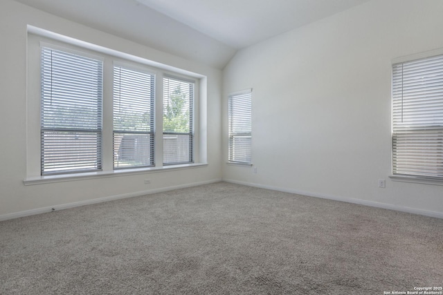 8639 Hedford, San Antonio, TX 78254 - carpeted empty room featuring vaulted ceiling and baseboards