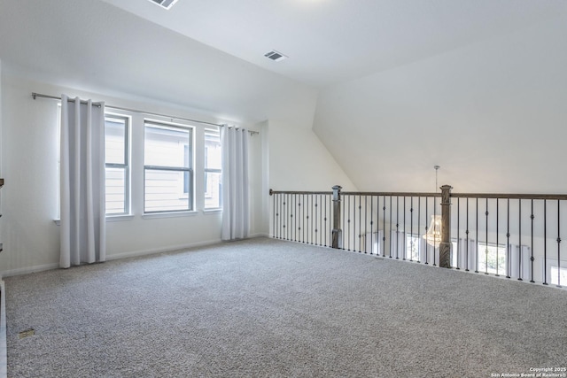 8639 Hedford, San Antonio, TX 78254 - additional living space with carpet floors, vaulted ceiling, and baseboards