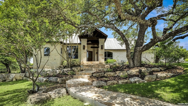 112 Legend Holw, Boerne, TX 78006 - view of front facade featuring stone siding, metal roof, and a front yard