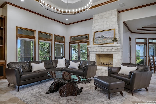 112 Legend Holw, Boerne, TX 78006 - living room featuring crown molding, a chandelier, plenty of natural light, a tray ceiling, and a stone fireplace
