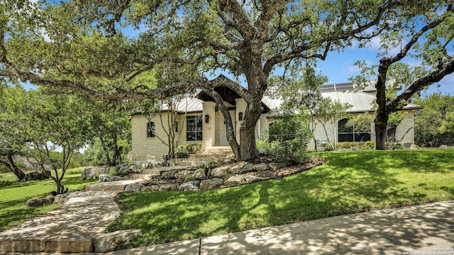 112 Legend Holw, Boerne, TX 78006 - view of front facade featuring a front lawn, metal roof, and a standing seam roof