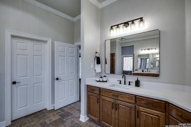 112 Legend Holw, Boerne, TX 78006 - bathroom featuring ornamental molding, vanity, and stone finish floors
