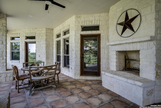 112 Legend Holw, Boerne, TX 78006 - porch with an outdoor stone fireplace and ceiling fan
