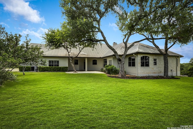 112 Legend Holw, Boerne, TX 78006 - view of front of property with a patio, a chimney, a front yard, and stone siding