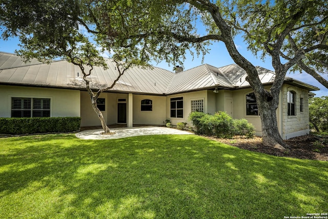 112 Legend Holw, Boerne, TX 78006 - rear view of house with a standing seam roof, stucco siding, metal roof, a patio area, and a chimney