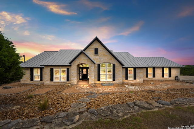 212 Vista Vw, Spring Branch, TX 78070 - view of front of house featuring a standing seam roof, metal roof, and stone siding